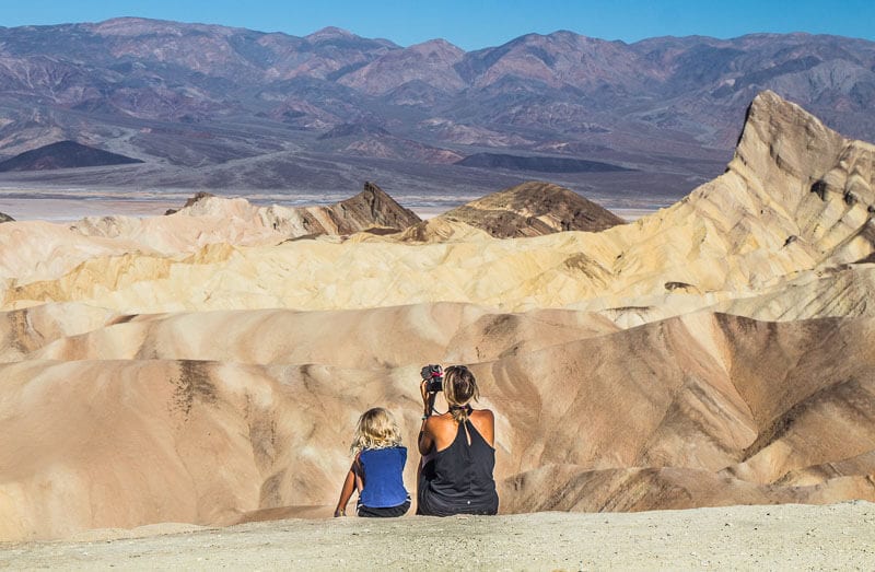 woman and child looking at zabriskie point Death Valley National Park California