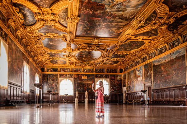 caz standing in middle of empty ballroom